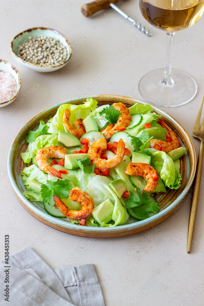 Salad with shrimp, cucumbers and avocado. Healthy eating. Vegetarian food.