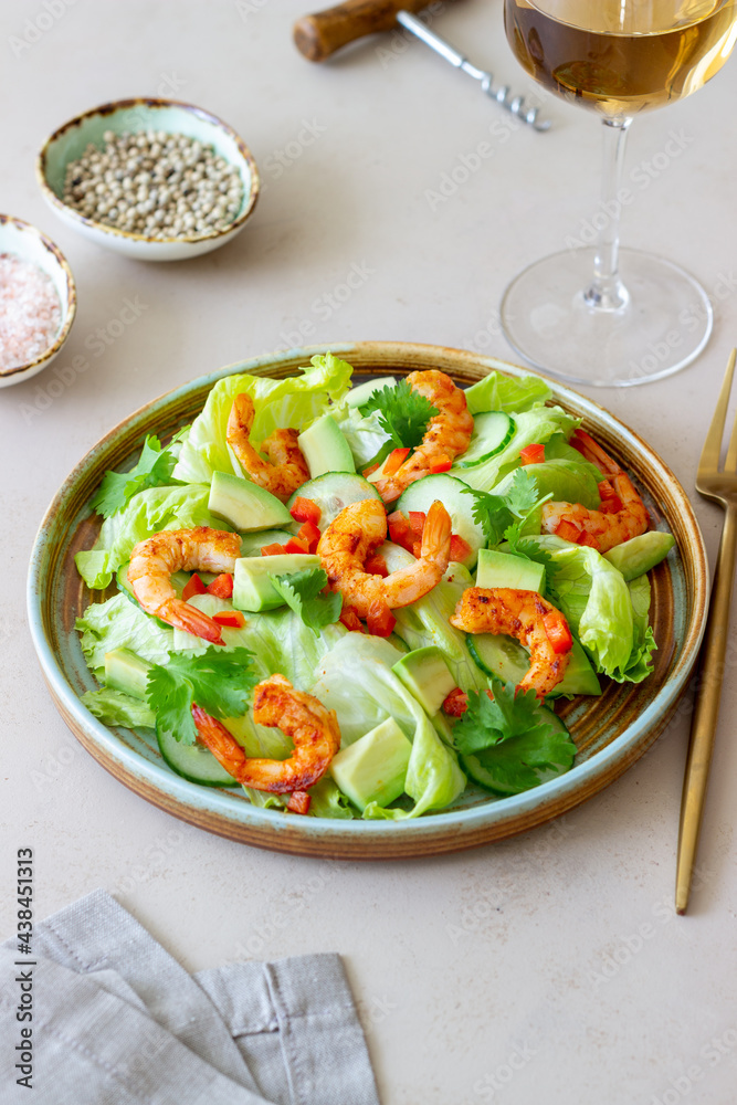 Salad with shrimp, cucumbers and avocado. Healthy eating. Vegetarian food. Salad with shrimp, cucumbers and avocado. Healthy eating. Vegetarian food.