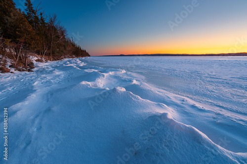 Snow drifts along frozen shoreline of Torch Lake in Northern Michigan.   © Keith Klosterman