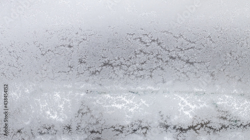 frosted home window in urban houses in winter © vvoe