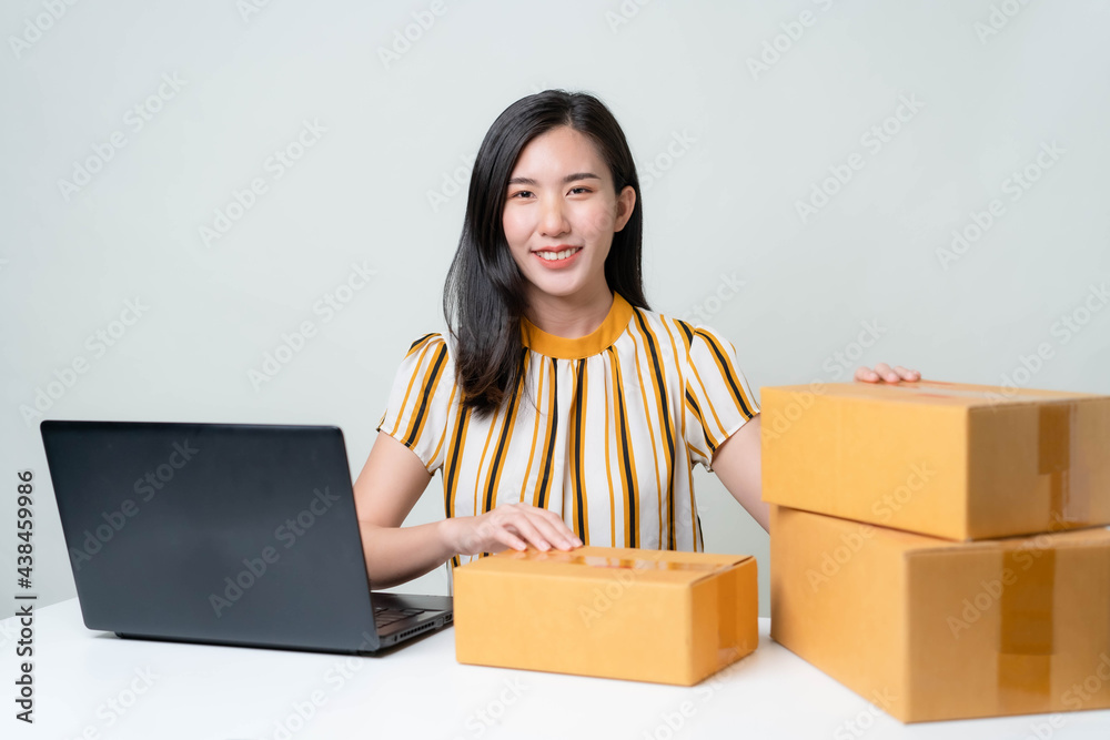 Asian women are starting a new business in the online market. Asian women checking products, preparing to deliver products to customers. SME Concept Asian women are starting a new business in the online market. Asian women checking products, preparing to deliver products to customers. SME Concept