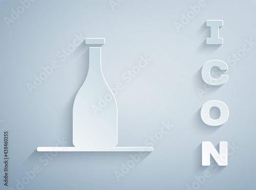 Paper cut Bottle of wine icon isolated on grey background. Paper art style. Vector
