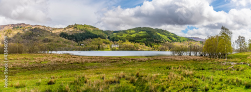 Fototapeta Naklejka Na Ścianę i Meble -  A panorama view across Loch Achray in the Scottish Highlands on a summers day
