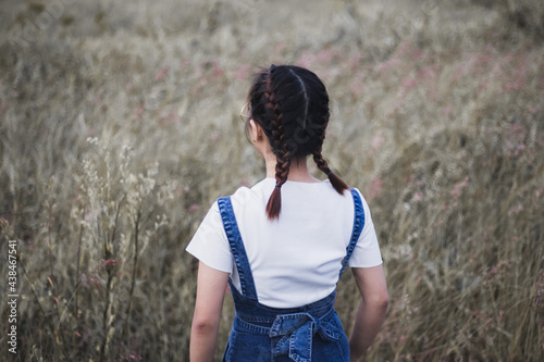 a woman is in the meadow