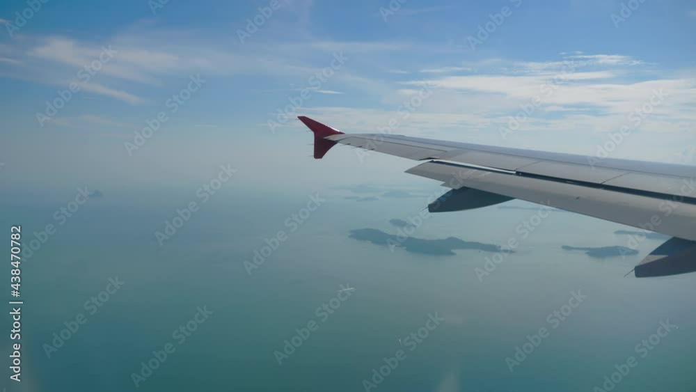 Plane flies over the ocean Plane flies over the ocean