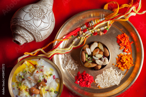 Close-up of puja thali (pooja plate) during preparation of Rakhsa Bhandhan. This festival is traditionally Indian festival for love and commitment between Brothers and Sisters. photo