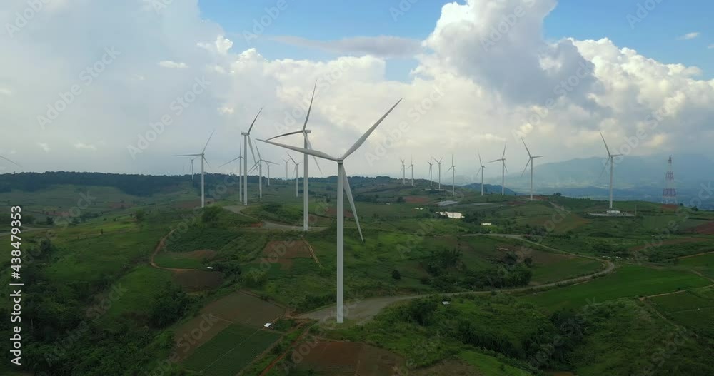 Aerial view of windmills farm on beautiful cloudy sky at highland Aerial view of windmills farm on beautiful cloudy sky at highland