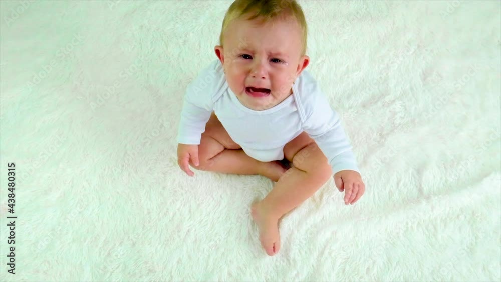 The little baby is crying. Selective focus. The little baby is crying. Selective focus.