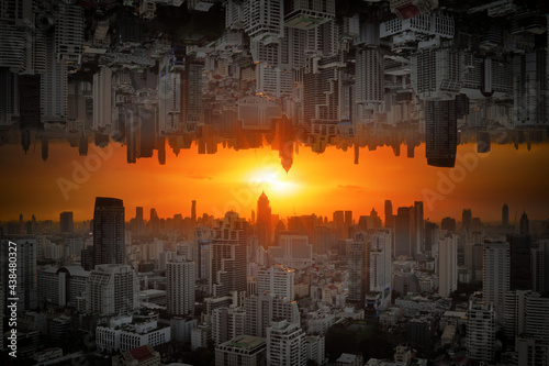 Invert City upside down with sunlight passing through at sunset