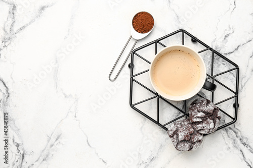 Cup of freshly brewed coffee on marble background