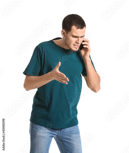 Angry young man talking by ...