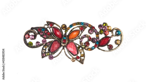 ancient brooch with precious stones isolated on white background