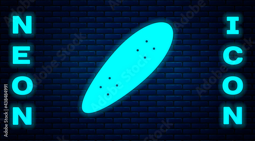 Glowing neon Longboard or skateboard cruiser icon isolated on brick wall background. Extreme sport. Sport equipment. Vector