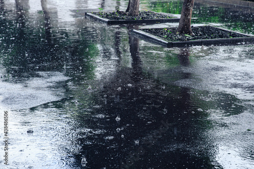 Black asphalt in heavy rain