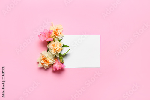 Beautiful flowers and blank card on color background © Pixel-Shot