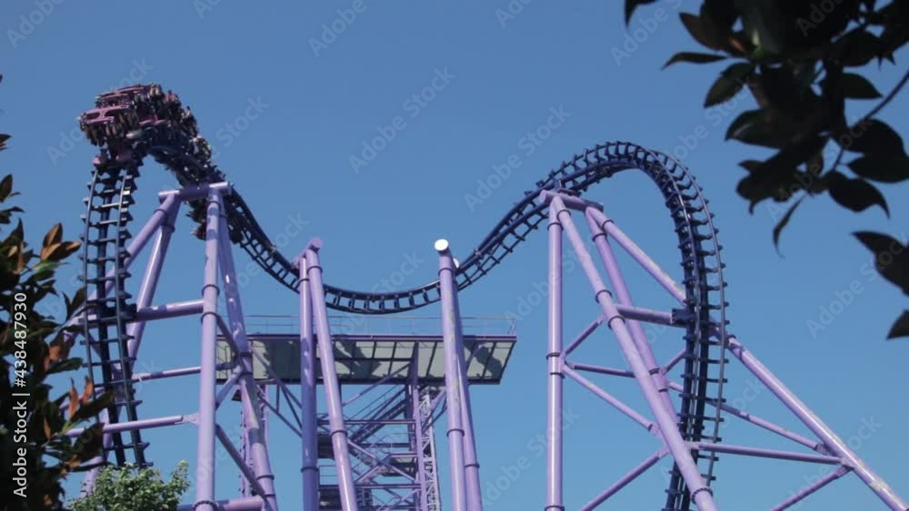 Ride on a heart shaped roller coaster on bright blue sky background Ride on a heart shaped roller coaster on bright blue sky background