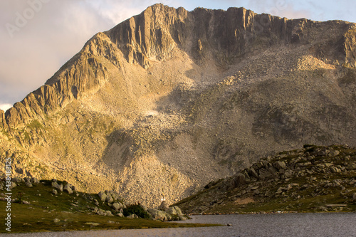 Tevno lake and Kamenitsa peak at Pirin Mountain, Bulgaria photo