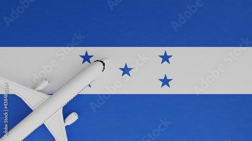 Top Down View of a Plane in the Corner on Top of the Country Flag of Honduras