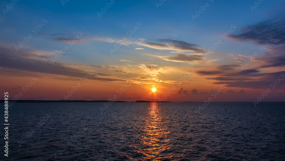 Sunrise over the sea. View of Lake Ladoga in the early morning at dawn from the ship.