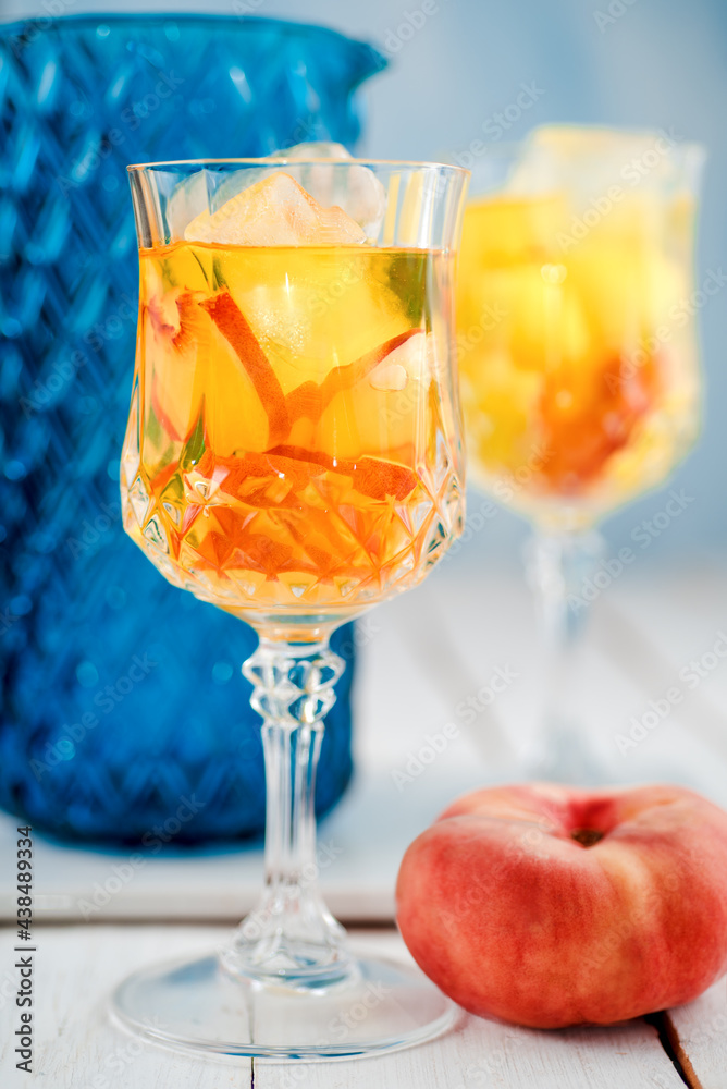 Peach juice and blue jug Peach juice and blue jug