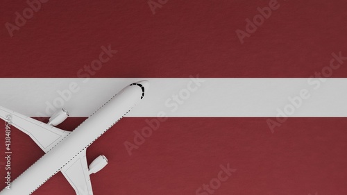 Top Down View of a Plane in the Corner on Top of the Country Flag of Latvia