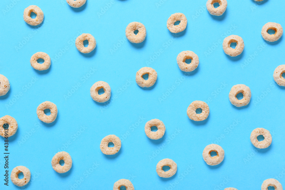 Tasty cereal rings on color background, closeup Tasty cereal rings on color background, closeup