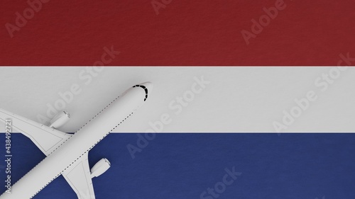 Top Down View of a Plane in the Corner on Top of the Country Flag of Netherlands