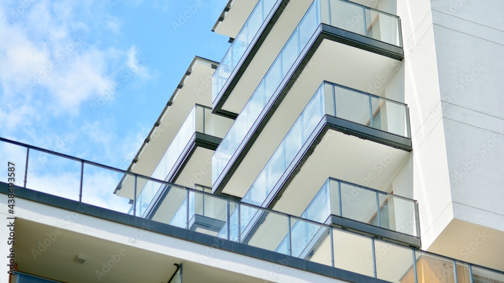 Fragment of modern luxury residential apartment, home house building  concept. Modern apartment building on a sunny day with a blue sky. Stock  Photo | Adobe Stock