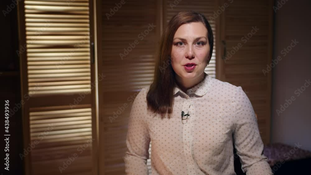 TV presenter or blogger with a professional make-up tells the information while looking at the camera. Makeup business woman. Prores422HQ, bmpcc4k TV presenter or blogger with a professional make-up tells the information while looking at the camera. Makeup business woman. Prores422HQ, bmpcc4k