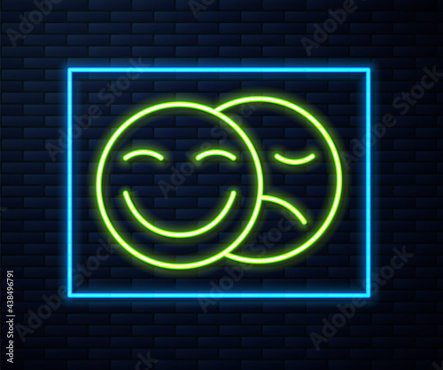 Glowing neon line Comedy and tragedy theatrical masks icon isolated on brick wall background. Vector