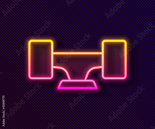 Glowing neon line Skateboard wheel icon isolated on black background. Skateboard suspension. Skate wheel. Vector