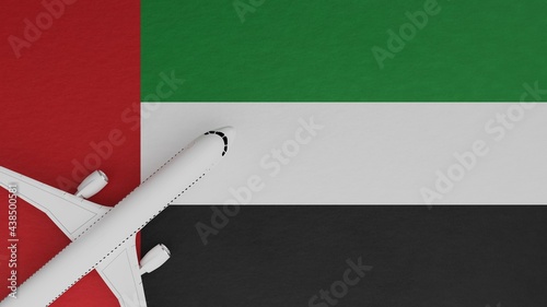Top Down View of a Plane in the Corner on Top of the Country Flag of United Arab Emirates