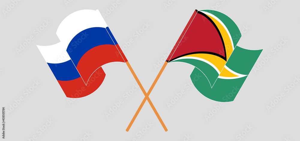 Crossed and waving flags of Russia and Guyana Crossed and waving flags of Russia and Guyana