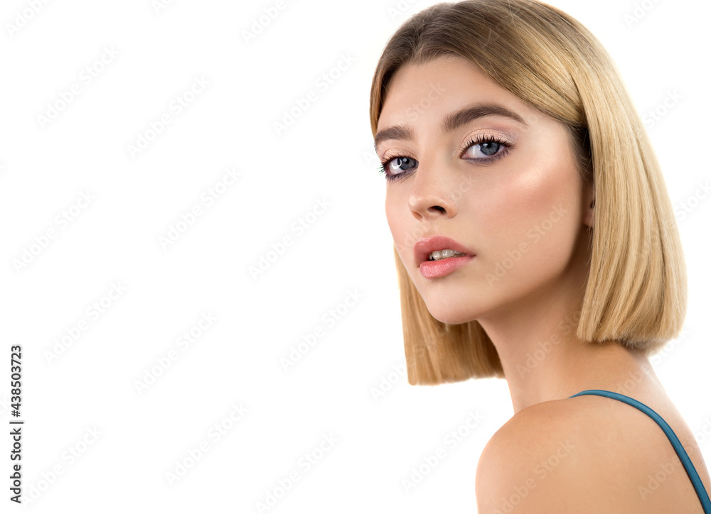 Naklejka premium Portrait of beauty model girl with natural make-up. Beautiful young blonde woman with perfect skin, short stylish blond bob hairstyle and classical makeup. Isolated on white. 