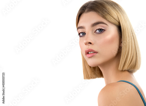 Portrait of beauty model girl with natural make-up. Beautiful young blonde woman with perfect skin, short stylish blond bob hairstyle and classical makeup. Isolated on white. 