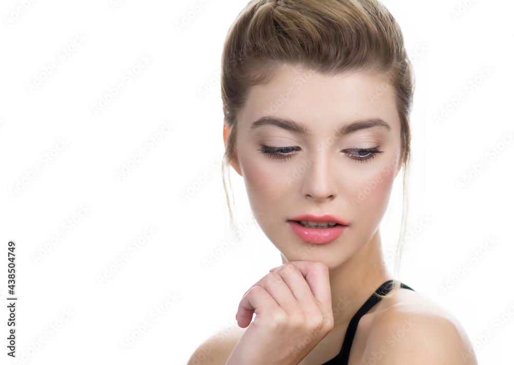 Beautiful young woman with clean perfect skin. Portrait of beauty model with professional make-up and long eyelashes isolated on white. Spa, skincare and wellness Beautiful young woman with clean perfect skin. Portrait of beauty model with professional make-up and long eyelashes isolated on white. Spa, skincare and wellness