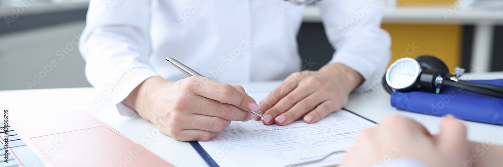 Patient at doctor's appointment in medical office Patient at doctor's appointment in medical office
