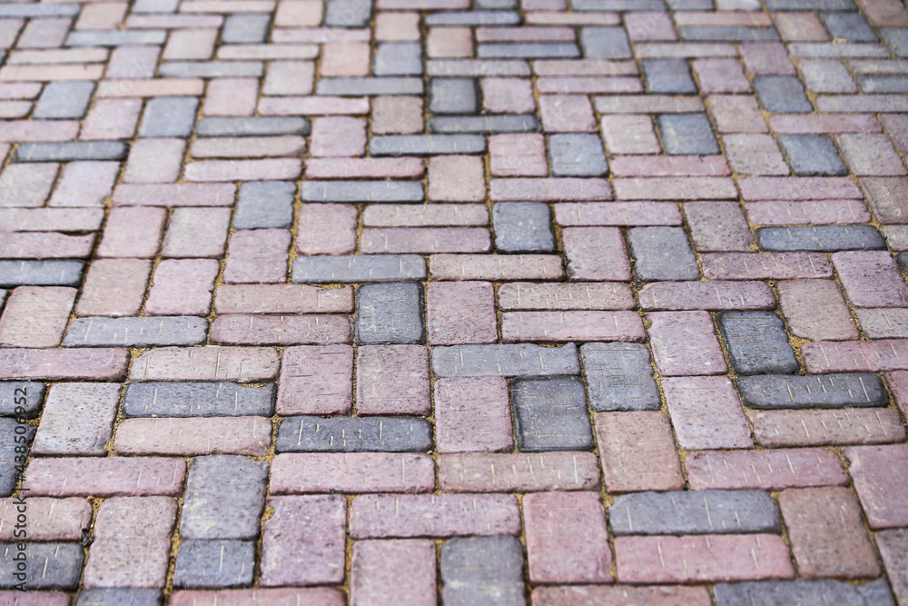 Sidewalk paved with red and gray rectangular tiles in perspective Sidewalk paved with red and gray rectangular tiles in perspective