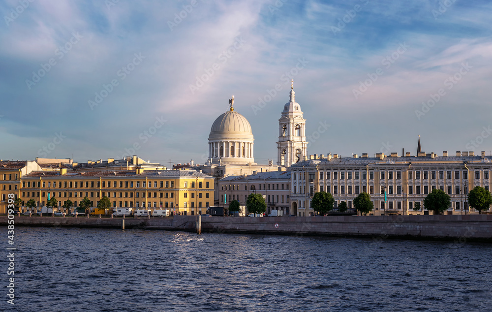 View from Tuchkov Bridge to the Makarov embankment and the domes of the Church of St. Catherine the Great Martyr on Vasilievsky Island in St. Petersburg