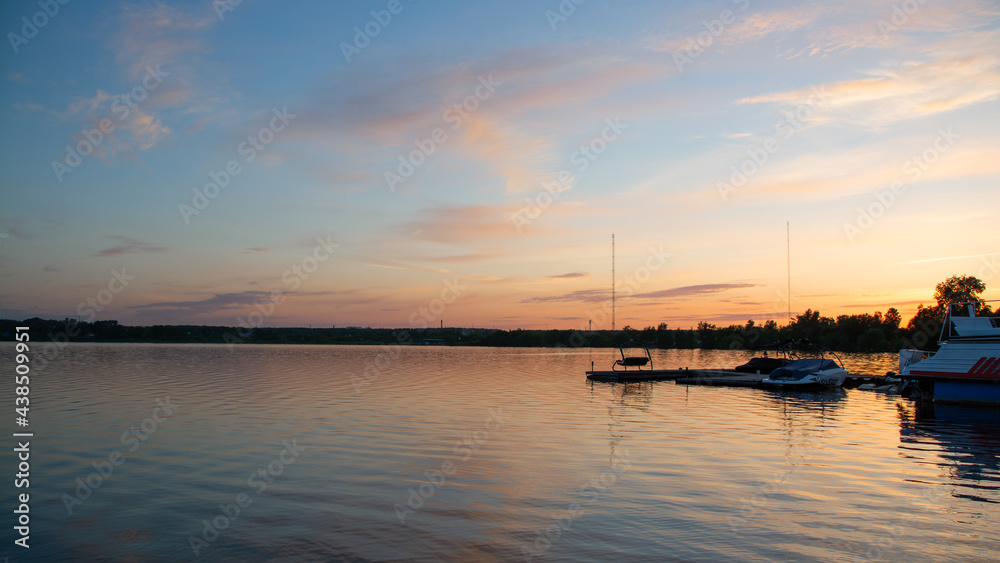 boats on the lake on the background of the sunset boats on the lake on the background of the sunset