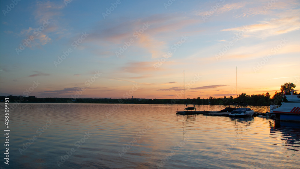 boats on the lake on the background of the sunset