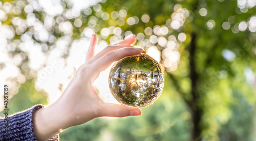 Hand holding glass ball photo