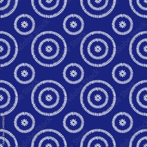Seamless blue and white African pattern. Indigo shweshwe print. Polka dot ornament. Vector illustration.