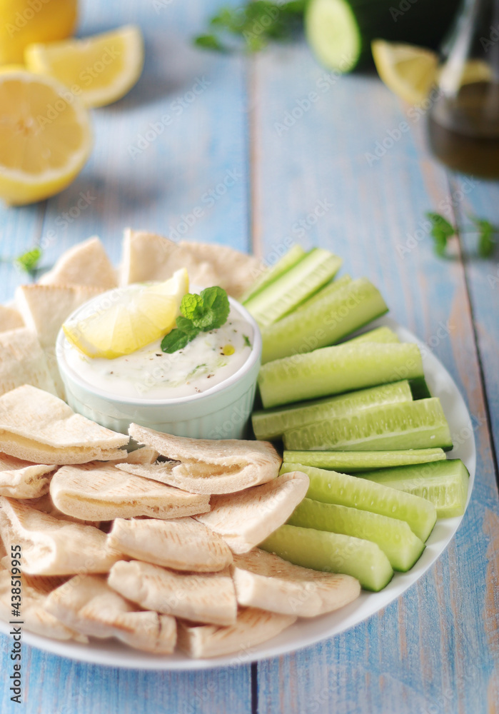 Tzatziki, Greek dip sauce with pita and cucumbers Tzatziki, Greek dip sauce with pita and cucumbers