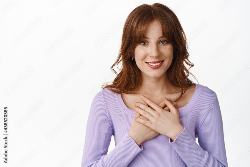 Thank you. Smiling modern girl, holding hands on heart and looking grateful, appreciate help, express gratitude, being touched and pleased, flattered by gift, standing over white background Thank you. Smiling modern girl, holding hands on heart and looking grateful, appreciate help, express gratitude, being touched and pleased, flattered by gift, standing over white background