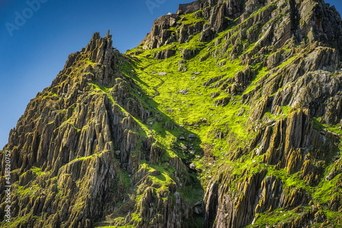 Foto Closeup on steep stairs or ladder carved in stone on Skellig Michael island wher