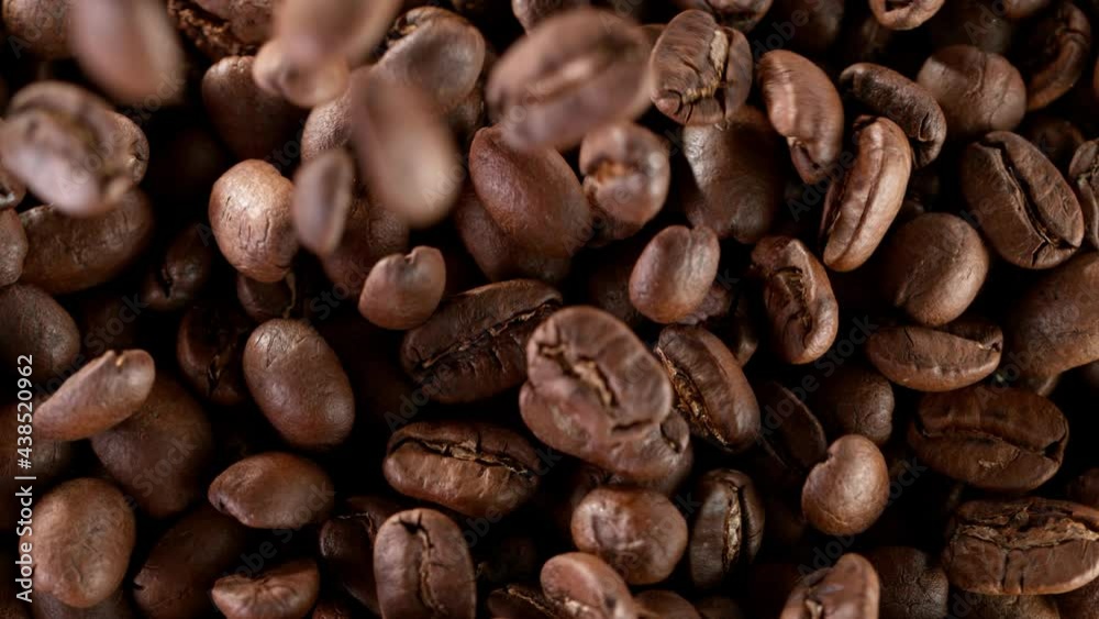 Coffee beans fall. Super slow motion at 1000 fps, filmed on high speed cinematic camera.