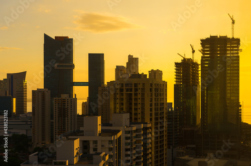 Panama city cityscape at sunrise with skyscraper construction in financial district and modern city center of Panama City, Panama, Central America.