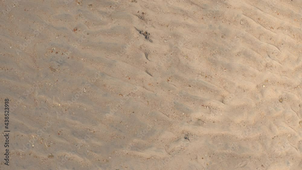 The rising sun instantly eats up the shadows on the sand dunes and immediately sets, covering them with darkness. The rising sun instantly eats up the shadows on the sand dunes and immediately sets, covering them with darkness.