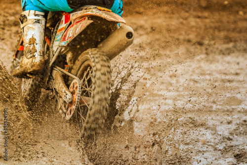 Flying debris during an acceleration in motocross race